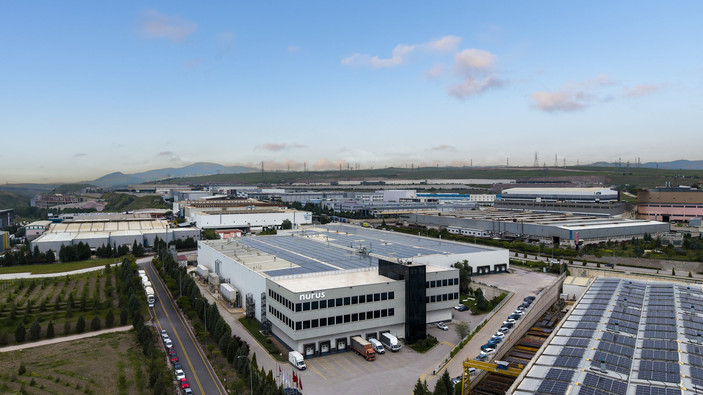 Aerial view of the Nurus production facility in Türkiye, solar arrays across the rooftops