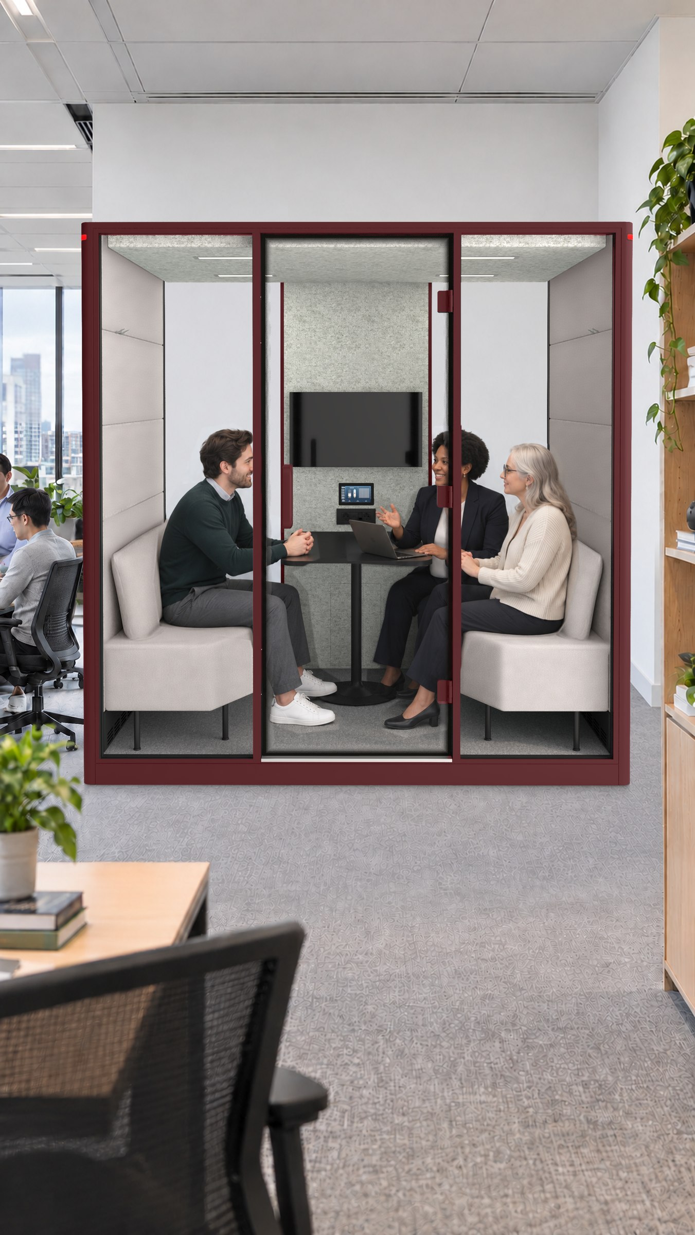 A Calma Large pod in a services firm, three people around the table inside